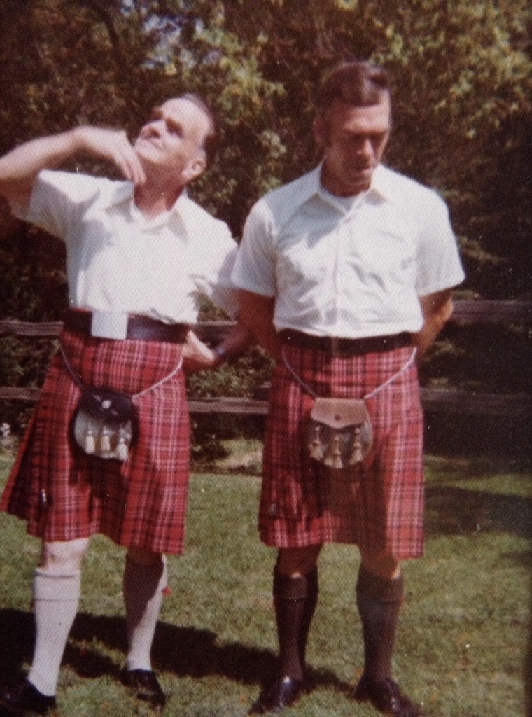 John's grandfather and great grandfather standing outside in their kilts.